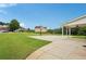 Spacious backyard features a basketball court and covered patio, perfect for outdoor activities and entertaining at 2825 Ellenwood Village Way, Ellenwood, GA 30294