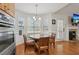 Bright breakfast nook features a round table, built-in seating, and lots of natural light from large windows at 2825 Ellenwood Village Way, Ellenwood, GA 30294