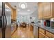 Well-equipped kitchen with stainless steel appliances, granite countertops, and hardwood floors, and breakfast nook at 2825 Ellenwood Village Way, Ellenwood, GA 30294
