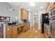 Functional kitchen featuring stainless steel appliances, granite countertops, hardwood floors and great lighting at 2825 Ellenwood Village Way, Ellenwood, GA 30294