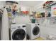 Functional laundry room with modern washer and dryer, plus shelving for storage and organization at 2825 Ellenwood Village Way, Ellenwood, GA 30294