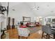Spacious living room featuring vaulted ceiling, hardwood floors, and modern decor and plenty of seating at 2825 Ellenwood Village Way, Ellenwood, GA 30294