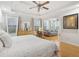 Serene main bedroom boasts tray ceilings, wood floors, and an attached sitting area, perfect for relaxation at 2825 Ellenwood Village Way, Ellenwood, GA 30294