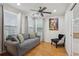 Cozy sitting room with comfortable couch, chair, and a bright window, ideal for reading or relaxing at 2825 Ellenwood Village Way, Ellenwood, GA 30294