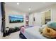 Bright bedroom featuring a modern bed, a window, and a flat screen TV at 3280 Stillhouse Se Ln # 212, Atlanta, GA 30339