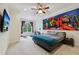 Stylish bedroom features a modern platform bed, unique wall art, and plush carpeting at 3280 Stillhouse Se Ln # 212, Atlanta, GA 30339