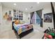 Well-lit bedroom with decorated shelves, a window, and gray curtains at 3280 Stillhouse Se Ln # 212, Atlanta, GA 30339