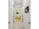 Hallway view leading to a bathroom with a standalone tub and tile flooring at 3280 Stillhouse Se Ln # 212, Atlanta, GA 30339