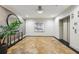 Hallway with patterned flooring, elegant lighting, decor, and access to an elevator at 3280 Stillhouse Se Ln # 212, Atlanta, GA 30339