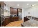 Spacious kitchen with granite countertops, stainless steel appliances, and wood flooring at 3280 Stillhouse Se Ln # 212, Atlanta, GA 30339