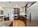 Well-equipped kitchen featuring stainless steel appliances, granite countertops, and wood floors at 3280 Stillhouse Se Ln # 212, Atlanta, GA 30339