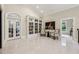 Bright library with large windows, built-in bookshelves, and comfortable seating area at 3280 Stillhouse Se Ln # 212, Atlanta, GA 30339