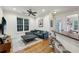Bright living room features a large window, modern furniture, and beautiful hardwood floors at 3280 Stillhouse Se Ln # 212, Atlanta, GA 30339