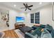Inviting living room features a large window, modern furniture, and hardwood floors at 3280 Stillhouse Se Ln # 212, Atlanta, GA 30339