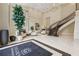 Elegant condo lobby featuring high ceilings, grand staircase, and comfortable seating area at 3280 Stillhouse Se Ln # 212, Atlanta, GA 30339