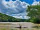 Scenic river view with lush green trees against a beautiful sky at 3280 Stillhouse Se Ln # 212, Atlanta, GA 30339