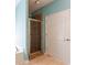 Modern bathroom featuring a glass-enclosed shower with tile surround and neutral walls at 381 Crossroads Dr, Social Circle, GA 30025