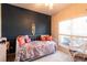 Cozy bedroom featuring a daybed with lots of decorative pillows and large window at 381 Crossroads Dr, Social Circle, GA 30025