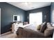 Bedroom featuring a bed, white dresser and a window that provides natural light at 381 Crossroads Dr, Social Circle, GA 30025