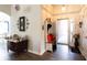 Inviting foyer with hardwood floors, a coat rack, and stylish decor at 381 Crossroads Dr, Social Circle, GA 30025