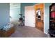 Hallway with open doorway to another room with hardwood flooring and custom ceiling design at 381 Crossroads Dr, Social Circle, GA 30025