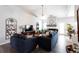 Spacious living room showcasing wood floors, high ceilings, modern furnishings, and an open layout at 381 Crossroads Dr, Social Circle, GA 30025