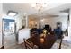 Open-concept view from kitchen into a bright living room and dining space with seamless flow for modern living at 381 Crossroads Dr, Social Circle, GA 30025