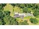 Aerial view of property with lush lawn, mature trees and landscaping at 3909 Laurens Ln, Snellville, GA 30039