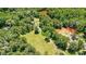 Aerial view of wooded property with lawn and mature trees at 3909 Laurens Ln, Snellville, GA 30039