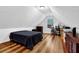 Bedroom featuring sloped ceiling, hardwood floor and window at 3909 Laurens Ln, Snellville, GA 30039