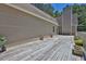 View of a long wooden deck featuring planters and landscaping at 3909 Laurens Ln, Snellville, GA 30039