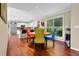 Sunlit dining room area with hardwood floors adjacent to the kitchen at 3909 Laurens Ln, Snellville, GA 30039