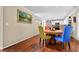 Bright dining room area featuring colorful chairs, hardwood floors, and recessed lighting at 3909 Laurens Ln, Snellville, GA 30039