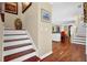 Entryway staircase leading to the living area with hardwood floors and neutral paint at 3909 Laurens Ln, Snellville, GA 30039