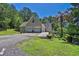 Shot of the garage with level driveway and wheelchair access ramp to the side at 3909 Laurens Ln, Snellville, GA 30039