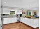 Beautiful kitchen featuring stainless steel appliances, granite counters, and white cabinetry at 3909 Laurens Ln, Snellville, GA 30039