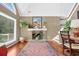 Cozy living room showcases a stone fireplace, hardwood floors, and natural light at 3909 Laurens Ln, Snellville, GA 30039