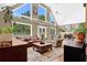 Spacious living room with vaulted ceilings, plush seating, and floor-to-ceiling windows at 3909 Laurens Ln, Snellville, GA 30039