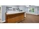 Finished basement bar featuring wood flooring, custom shelving, and a wet bar at 4000 Mcpherson Drive, Acworth, GA 30101