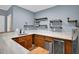 Finished basement featuring a bar area with wood cabinets, countertop, and shelving at 4000 Mcpherson Drive, Acworth, GA 30101