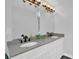Bathroom featuring dual sinks, granite countertop, vanity with white cabinets, and modern fixtures at 4000 Mcpherson Drive, Acworth, GA 30101