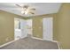 Bedroom featuring neutral carpet, a ceiling fan, and a view to the bathroom at 4000 Mcpherson Drive, Acworth, GA 30101