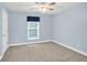 Charming bedroom with neutral carpet, and natural light streaming in through the large window at 4000 Mcpherson Drive, Acworth, GA 30101