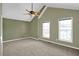 Bright bedroom with vaulted ceiling, ceiling fan, carpet, and natural light from the windows at 4000 Mcpherson Drive, Acworth, GA 30101