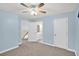 Bedroom featuring a view into the bathroom, two doors, carpeted floor and neutral paint at 4000 Mcpherson Drive, Acworth, GA 30101