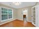 Dining room with wood floors, a large window, and French doors leading to the living room at 4000 Mcpherson Drive, Acworth, GA 30101