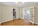 Dining room with wood floors, a modern light fixture, and French doors leading to the living room at 4000 Mcpherson Drive, Acworth, GA 30101