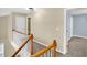 Upstairs hallway featuring carpet and white wood railing at 4000 Mcpherson Drive, Acworth, GA 30101