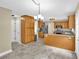 Well-lit kitchen boasts ample wooden cabinets and stainless steel appliances at 4000 Mcpherson Drive, Acworth, GA 30101