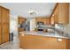 Bright kitchen area features wood cabinets, marble countertop, and stainless appliances at 4000 Mcpherson Drive, Acworth, GA 30101